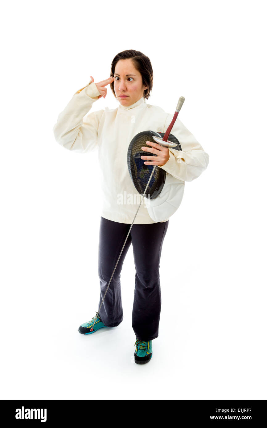 Female fencer making gun with hand pointed at head Stock Photo
