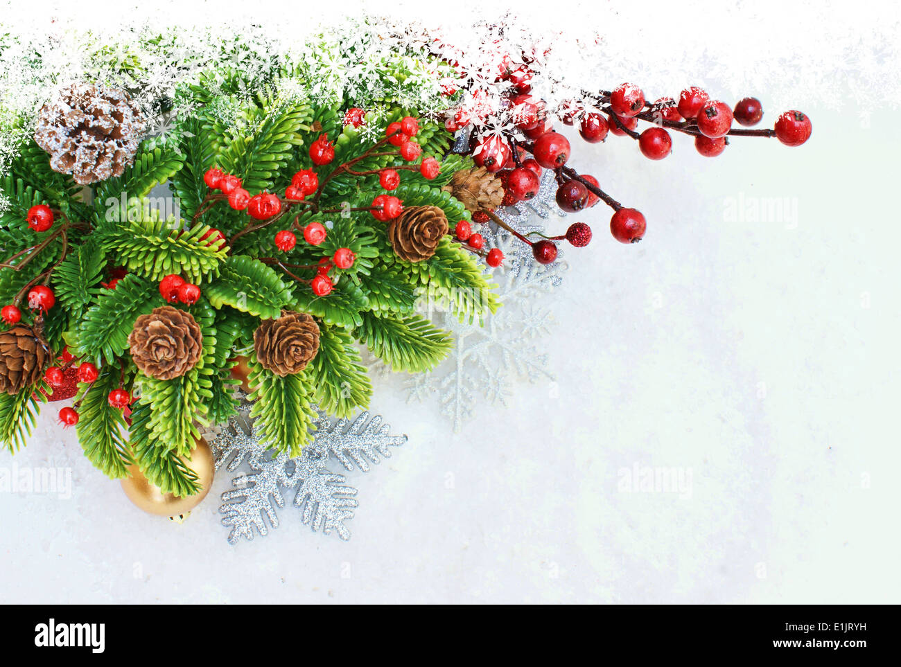 Christmas background with berries and snowflakes Stock Photo