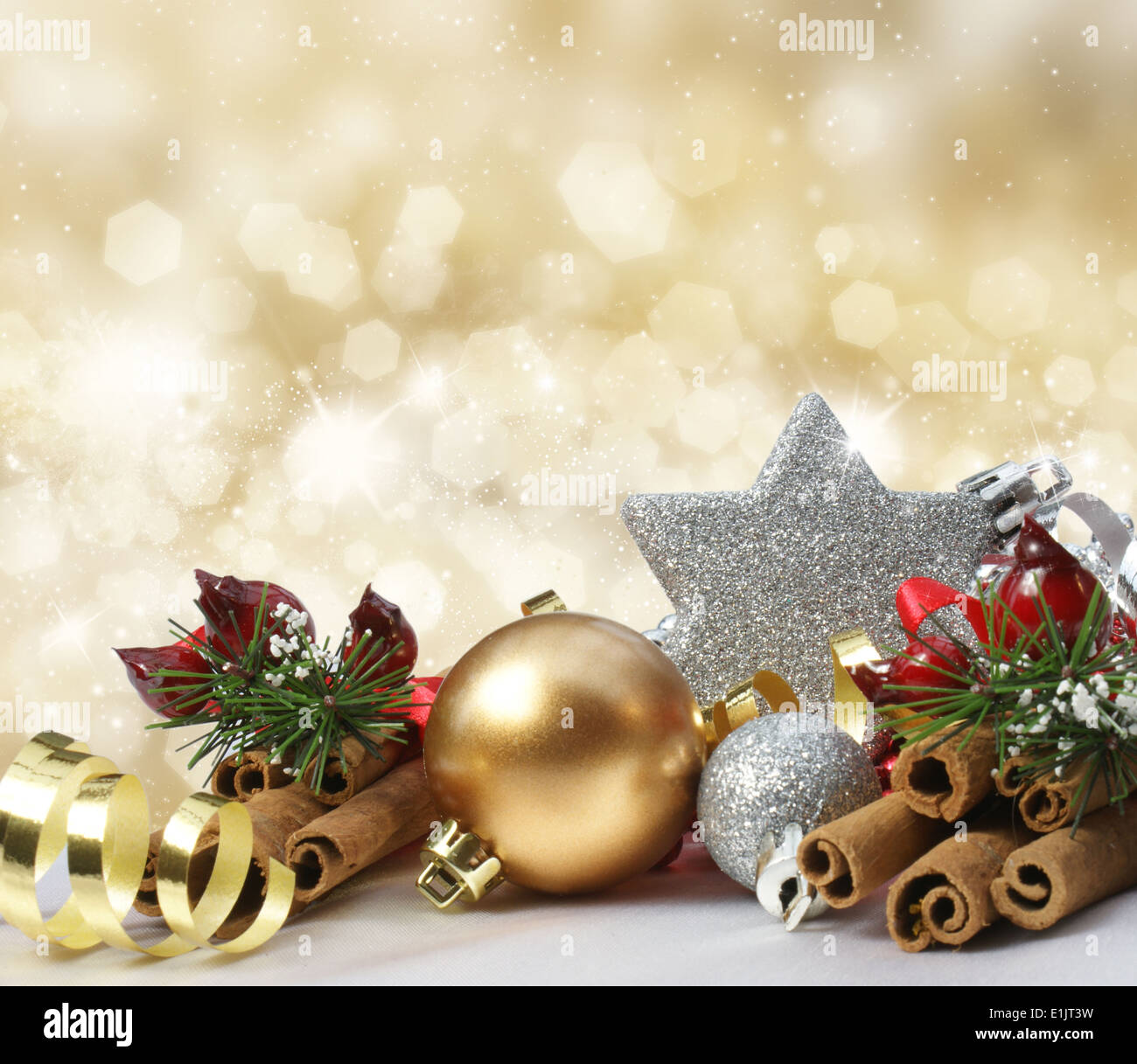 Christmas decorations on a glittery gold background Stock Photo - Alamy