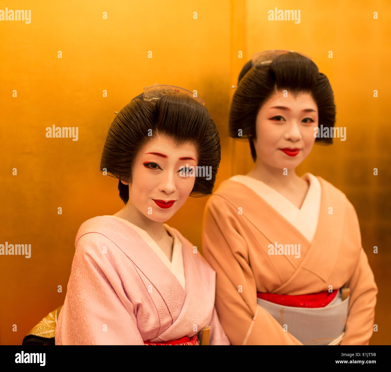 Geisha (nearest camera) and apprentice geisha, maiko. Stock Photo