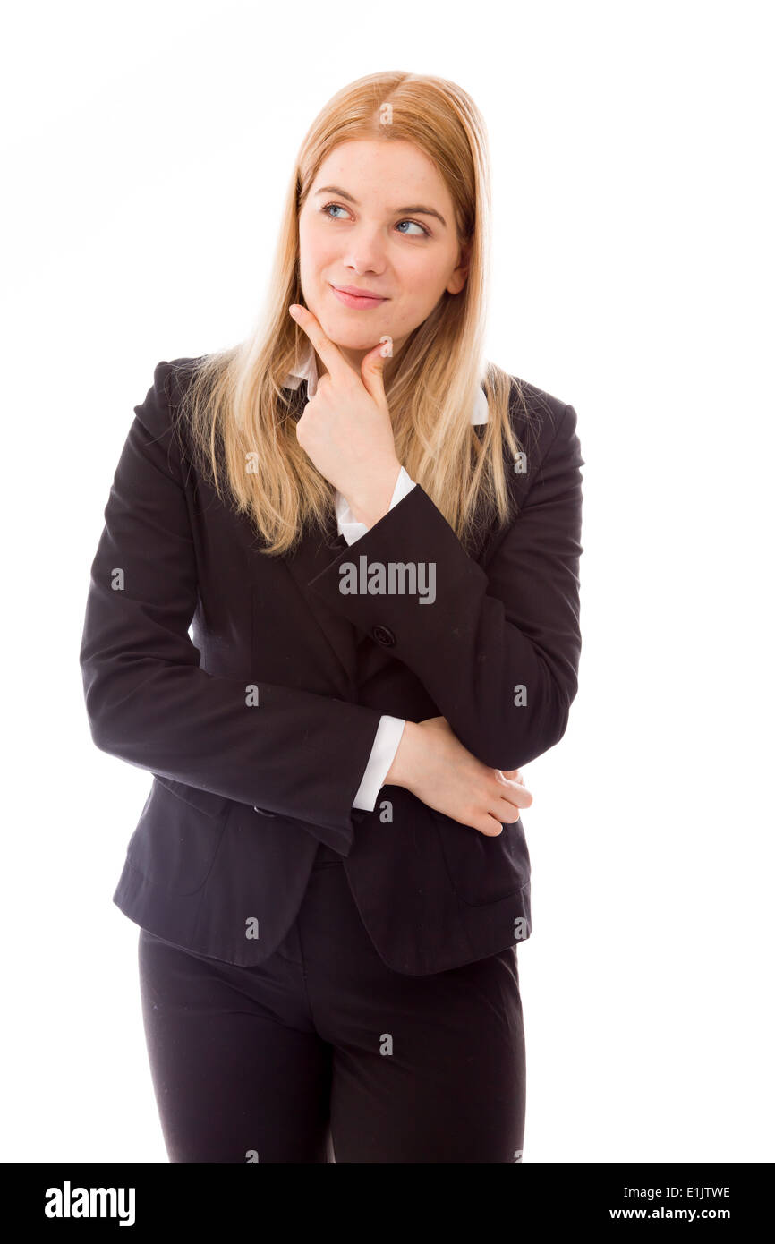 Businesswoman daydreaming with hand on chin Stock Photo