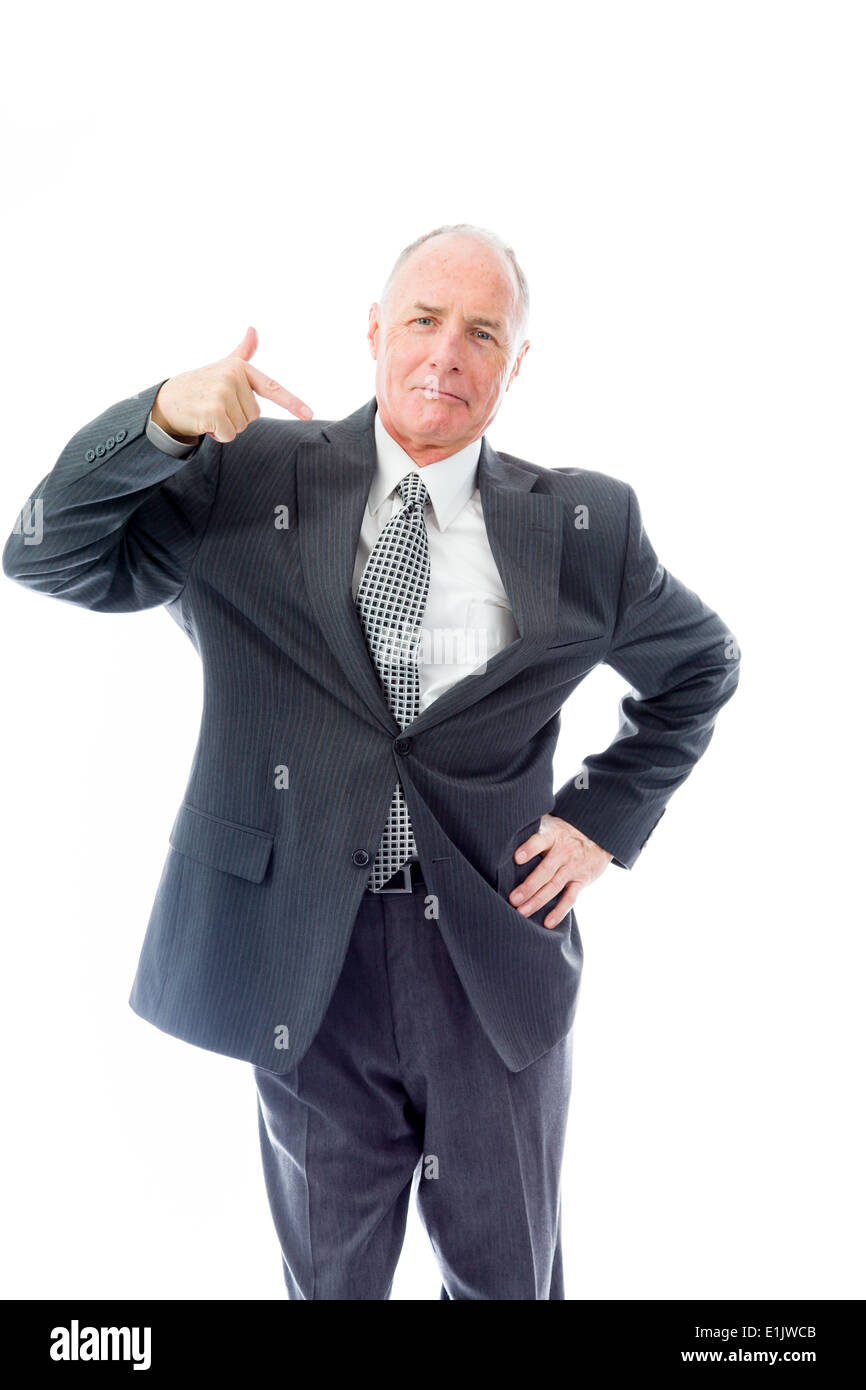 Businessman standing with hand on waist and pointing Stock Photo