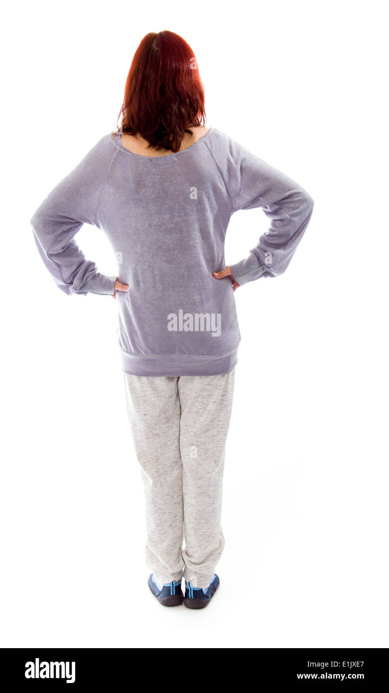 Rear view of a mature woman standing with her arms akimbo Stock Photo