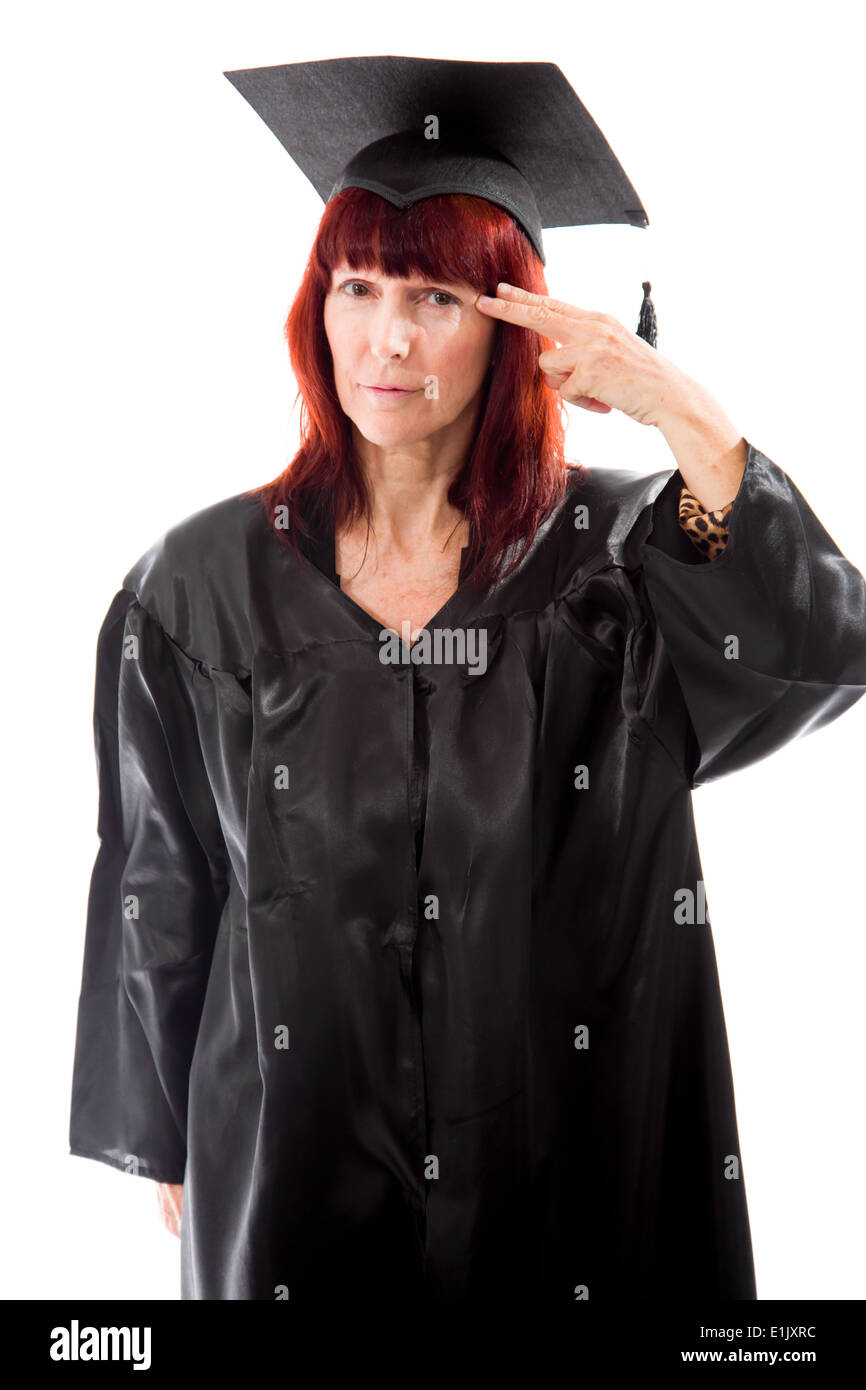 Mature student holding her finger against her head Stock Photo