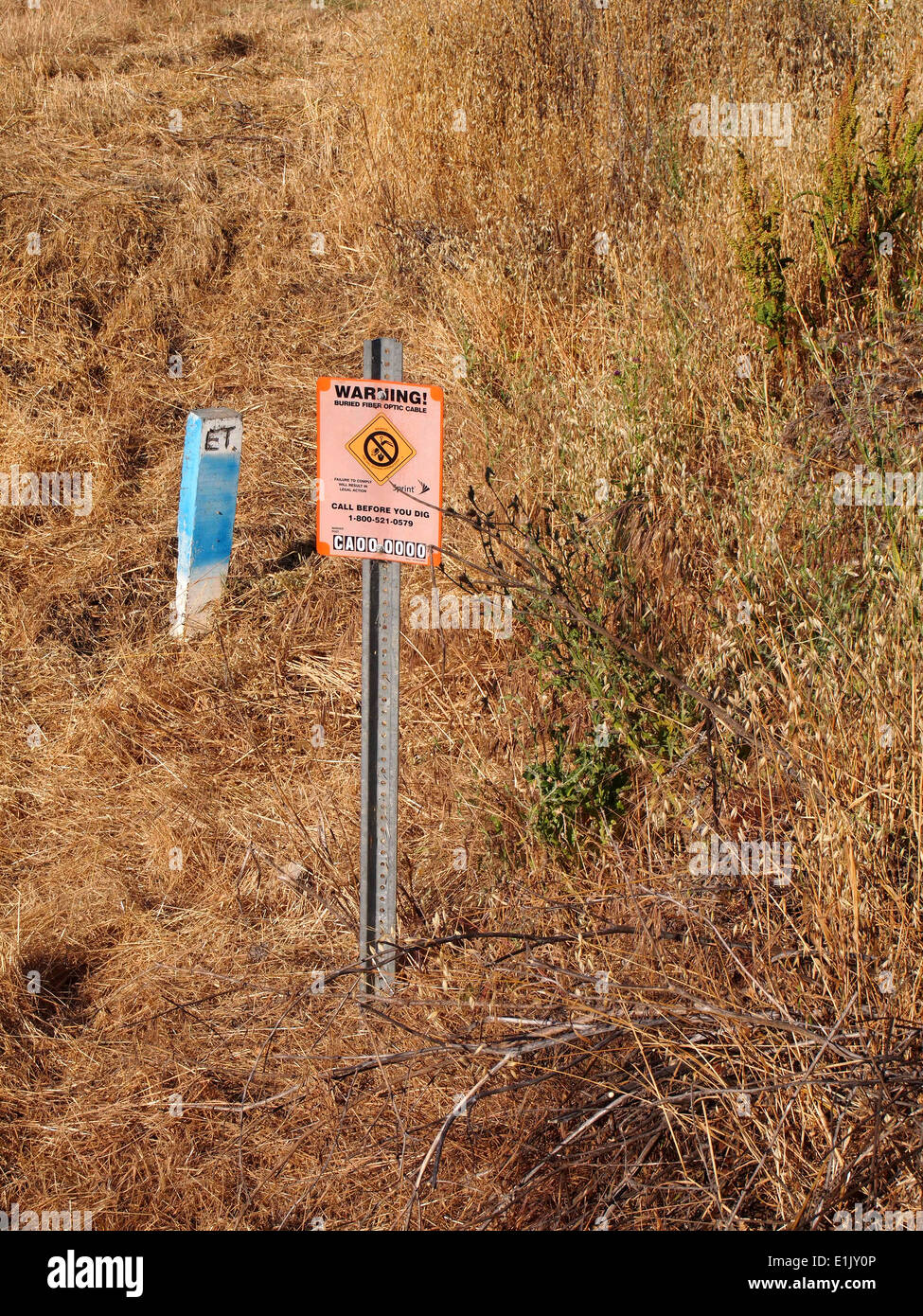 Warning buried fiber optic cable sign marker Fremont California Stock Photo