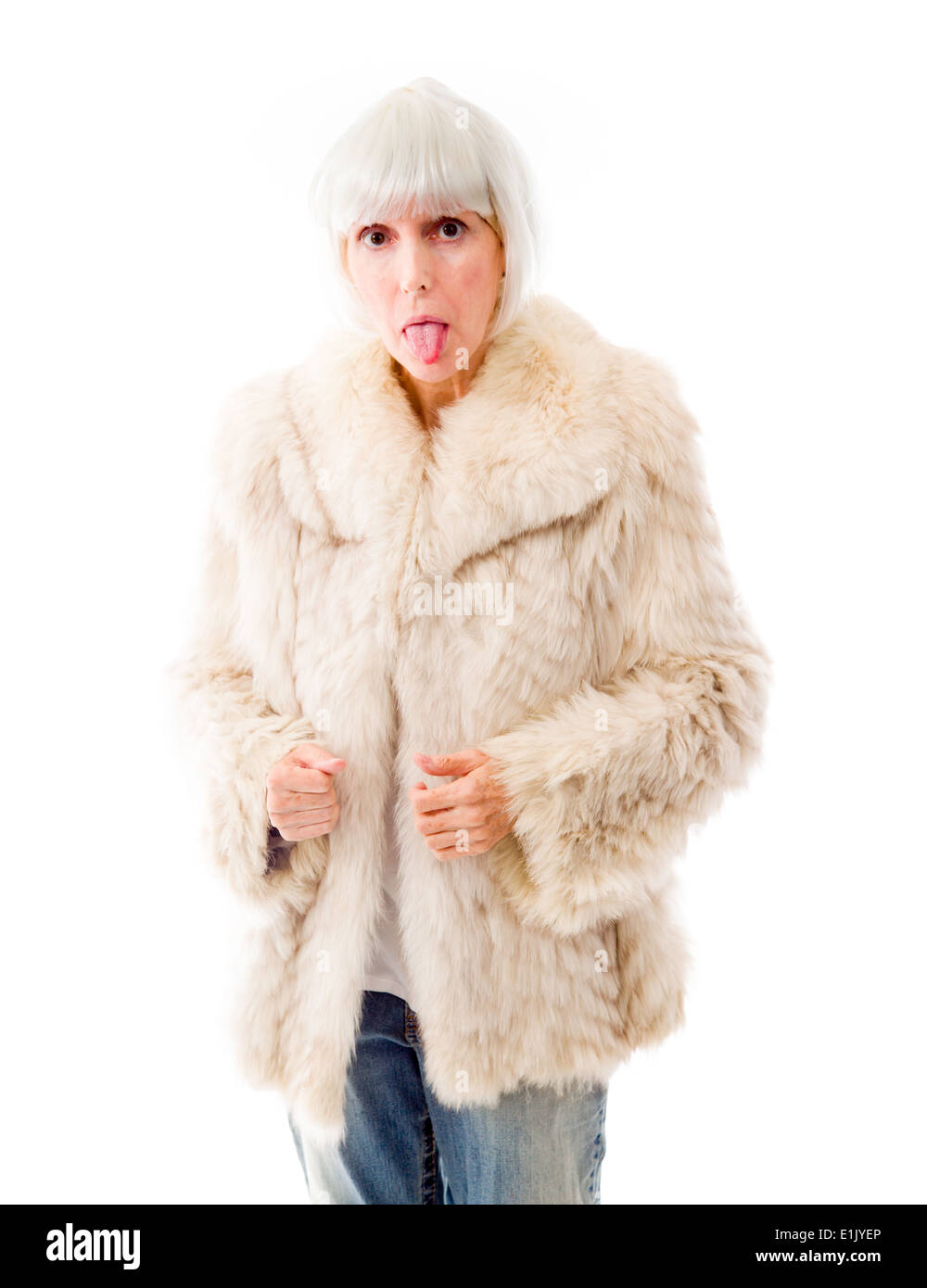 Senior woman sticking out her tongue Stock Photo