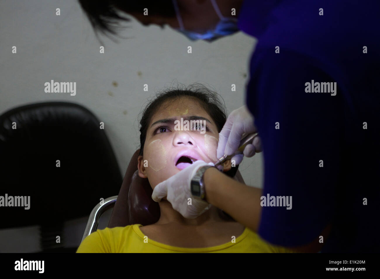 Dental care is provided to a female patient. The Mae Tao Clinic serves
