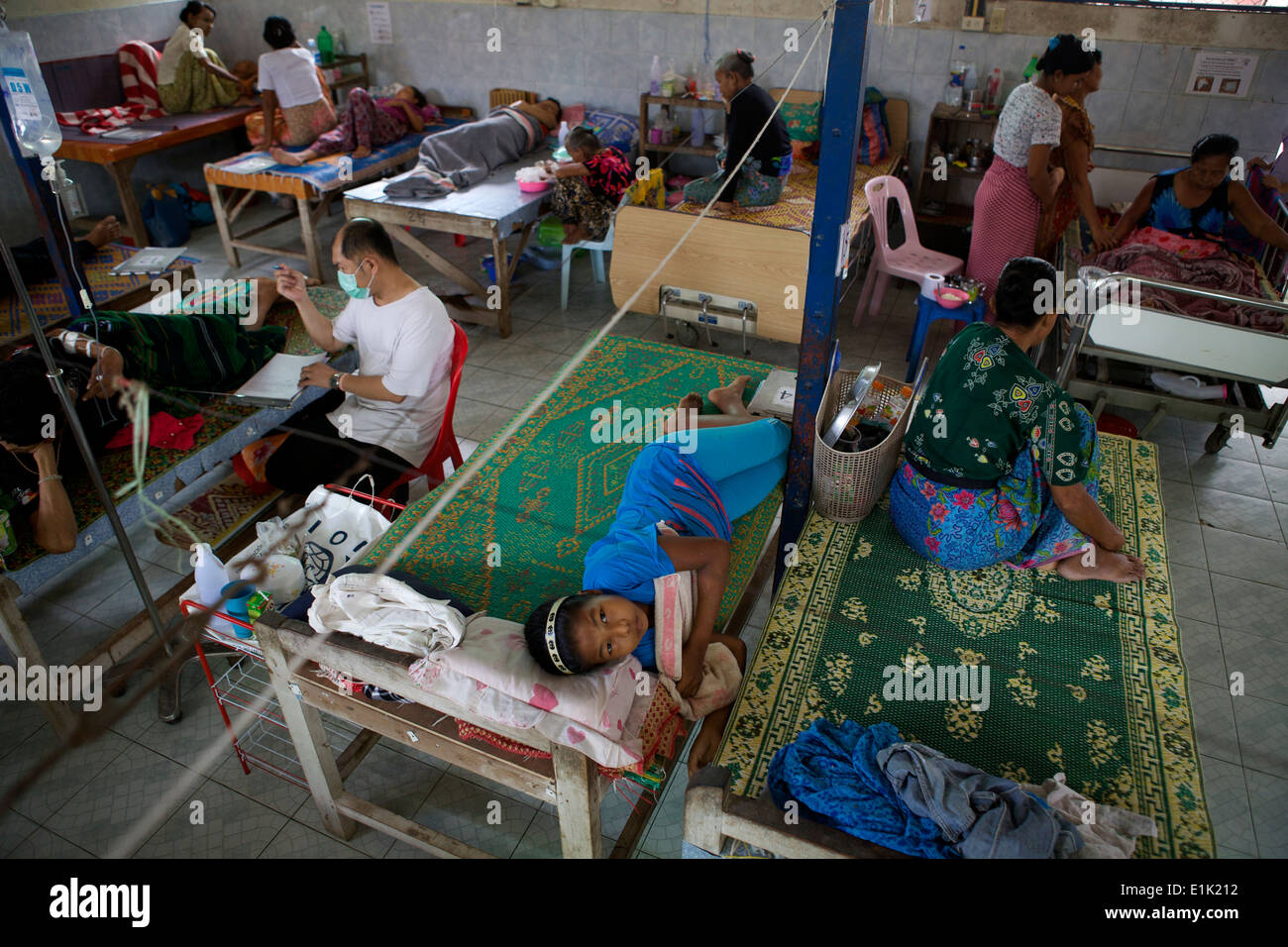 Patients fill up the hospital beds. The Mae Tao Clinic serves thousands of refugees from Myanmar, people displaced by decades of internal conflict. Stock Photo