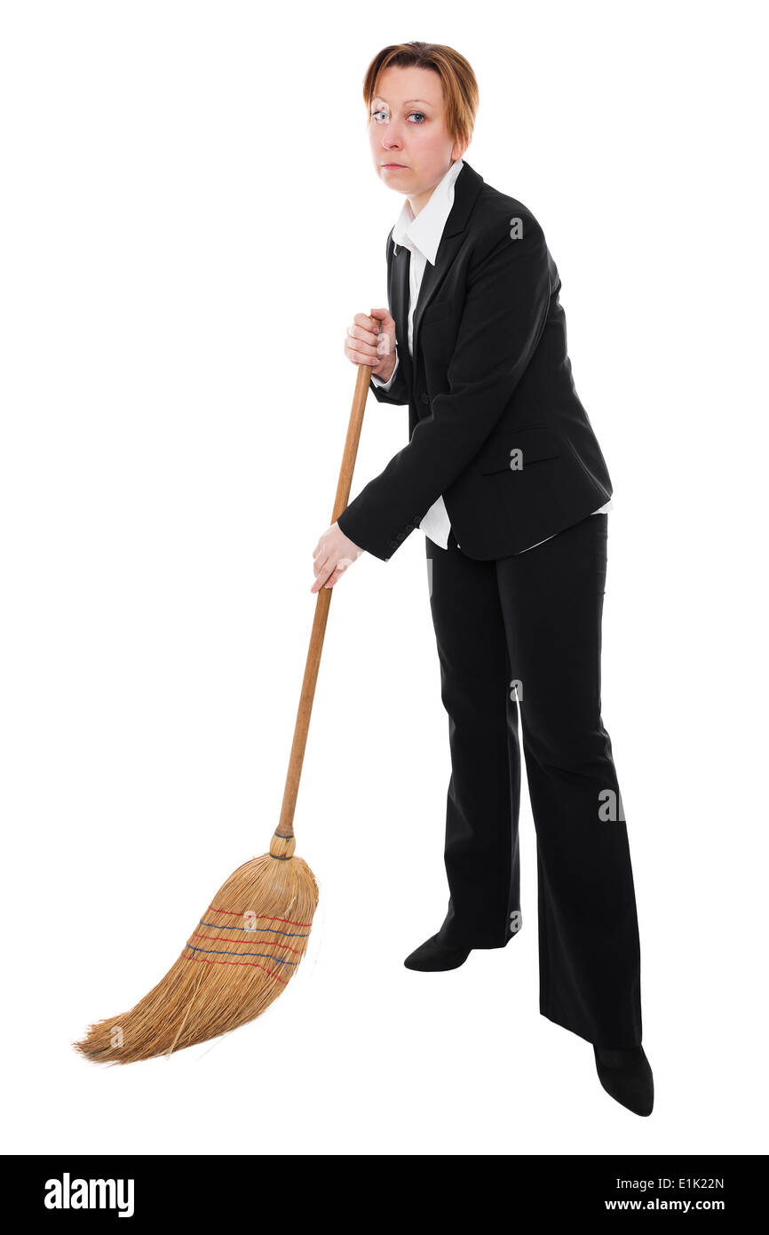 Businesswoman with a broom is cleaning the ground Stock Photo