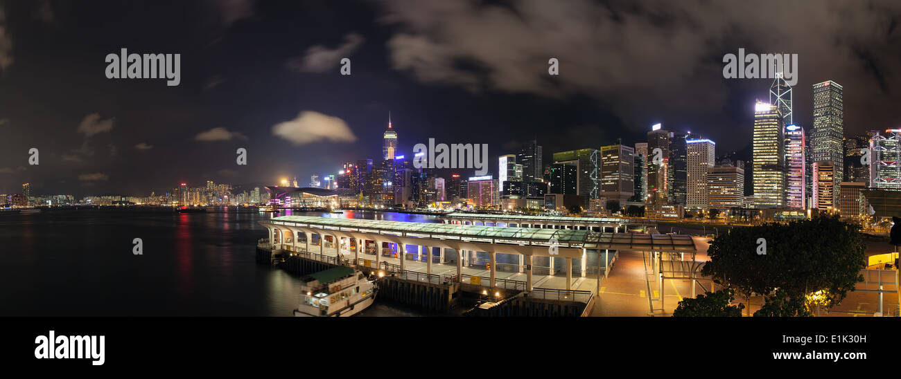Hong Kong Central Ferry Pier with City Skyline at Night Panorama Stock Photo