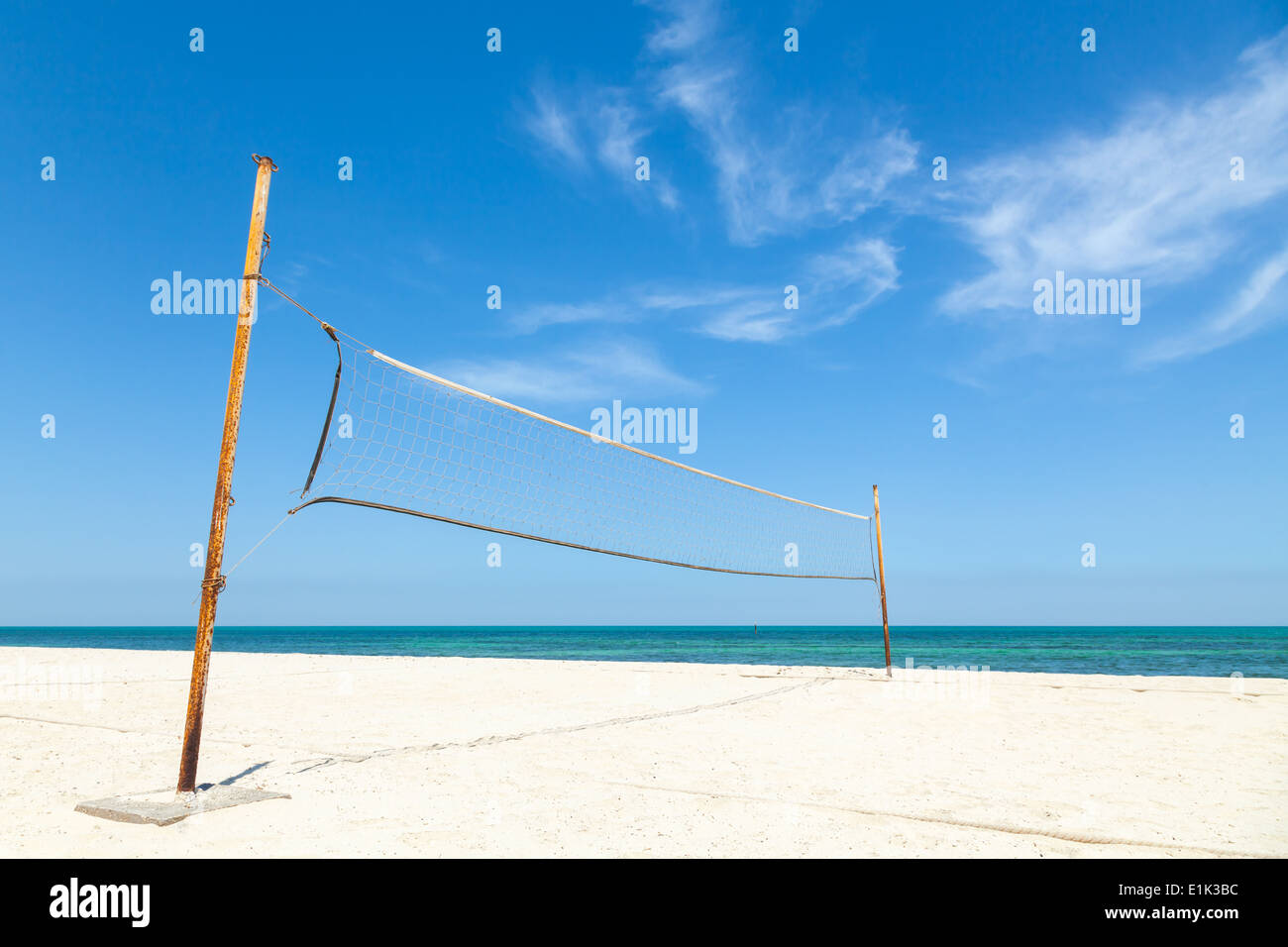 Net for beach volleyball on empty sea coast Stock Photo