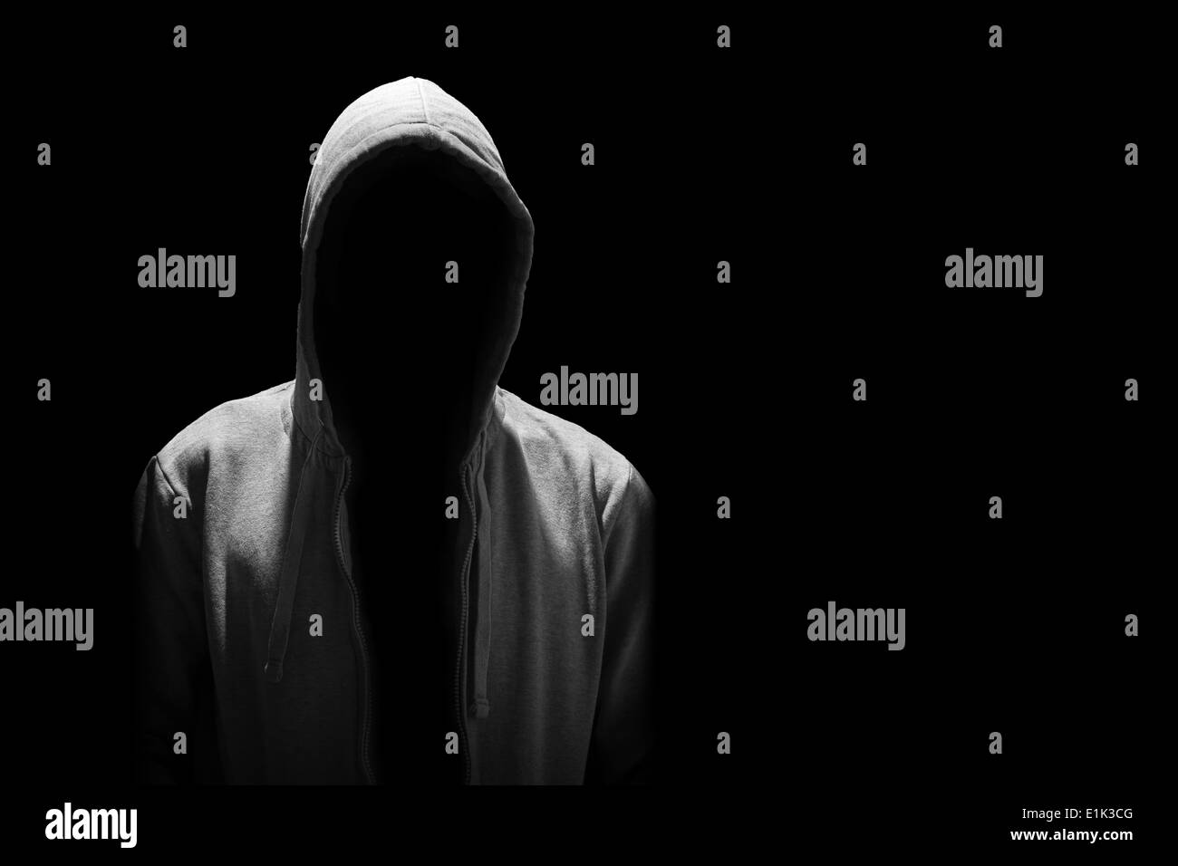 Portrait of Invisible man in the hood isolated on black Stock Photo