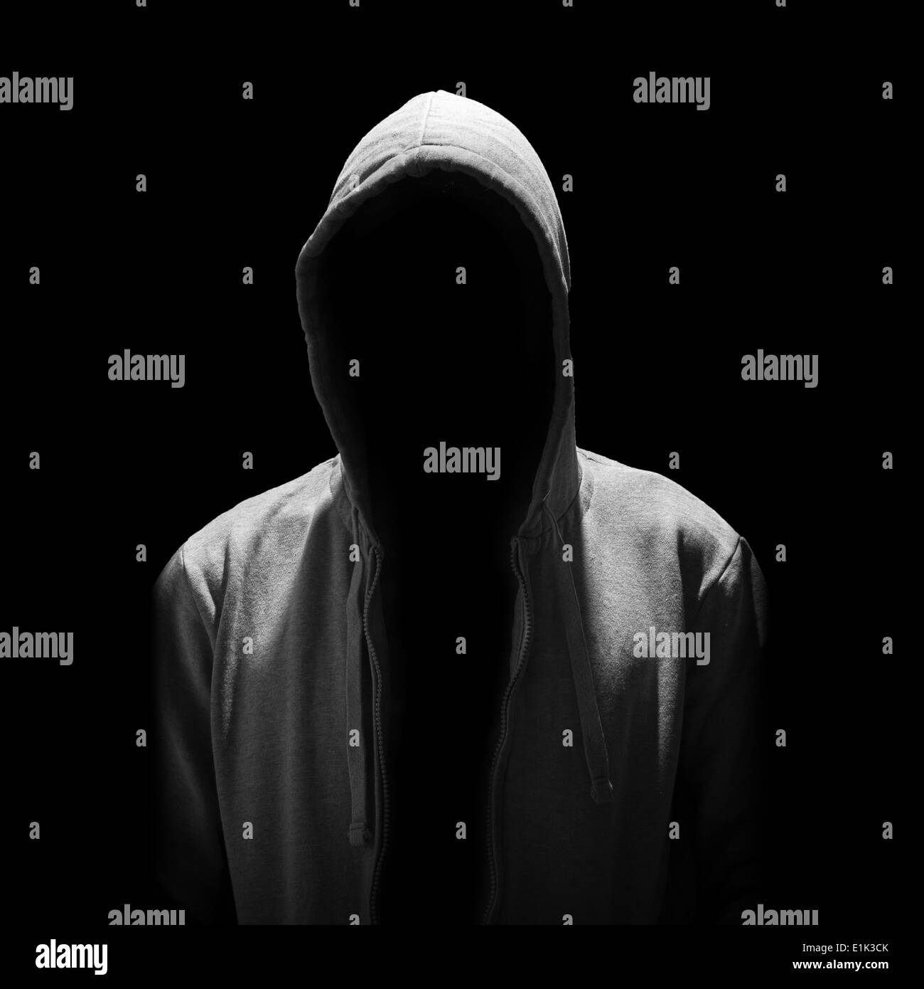 Portrait of Invisible man in the hood isolated on black background Stock Photo
