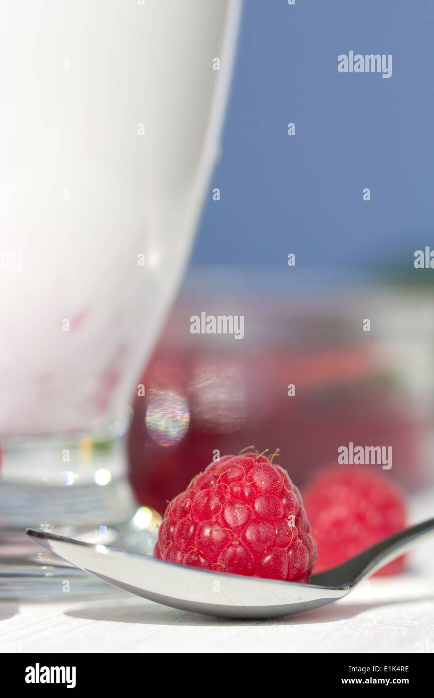 Raspberry milk, Raspberry on spoon Stock Photo - Alamy