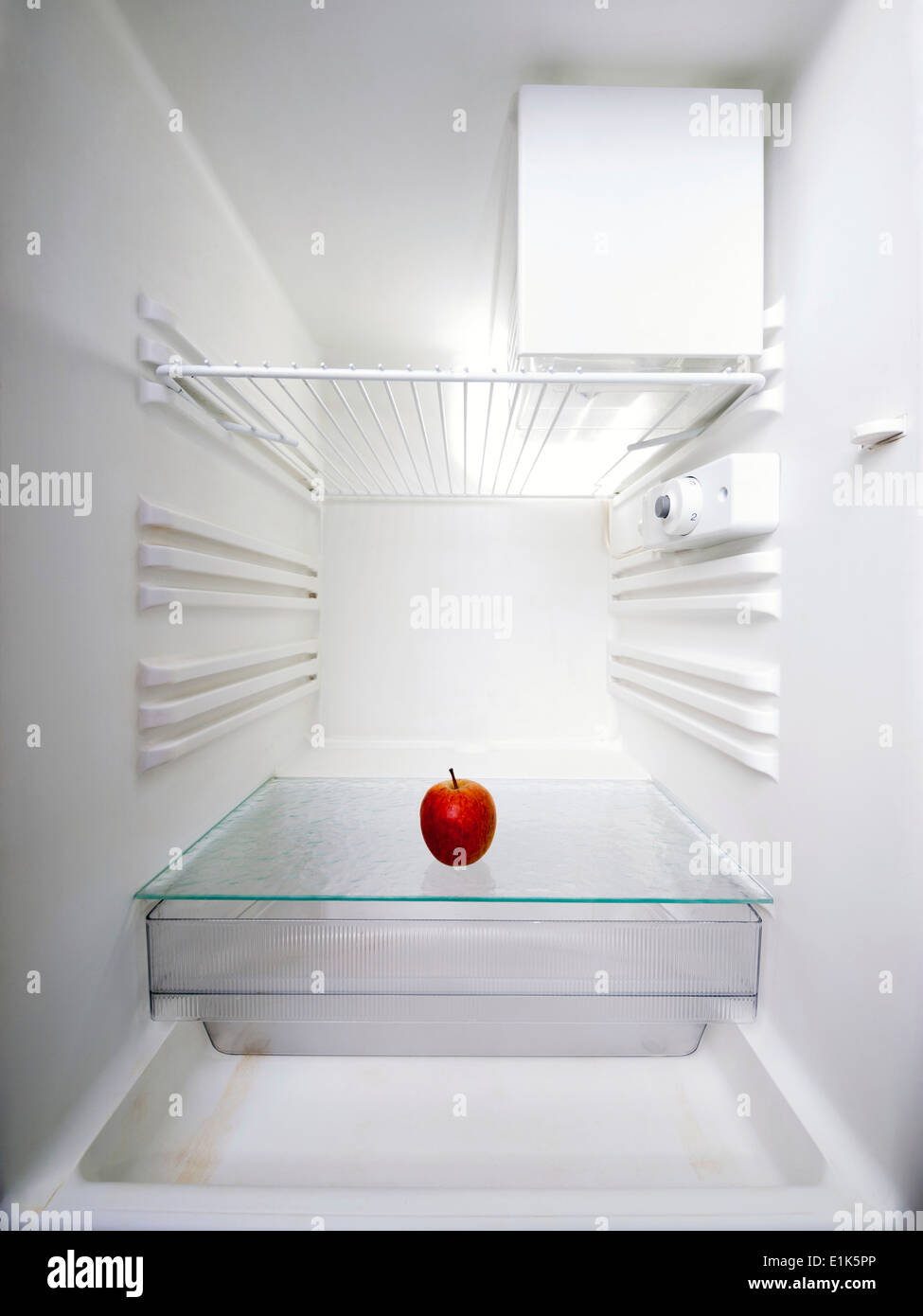 Red apple in an empty fridge Stock Photo Alamy