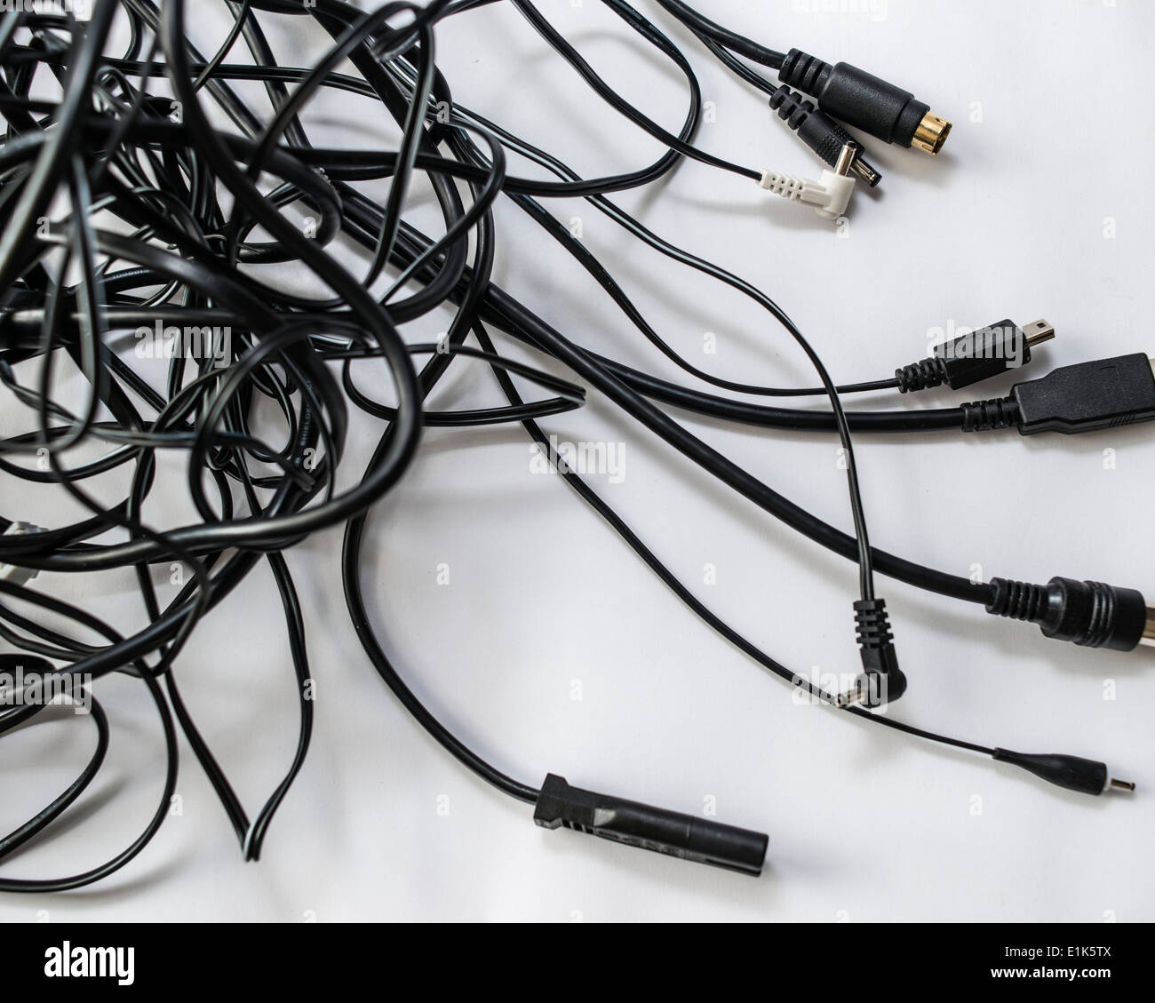 Tangle of leads with different connectors Stock Photo