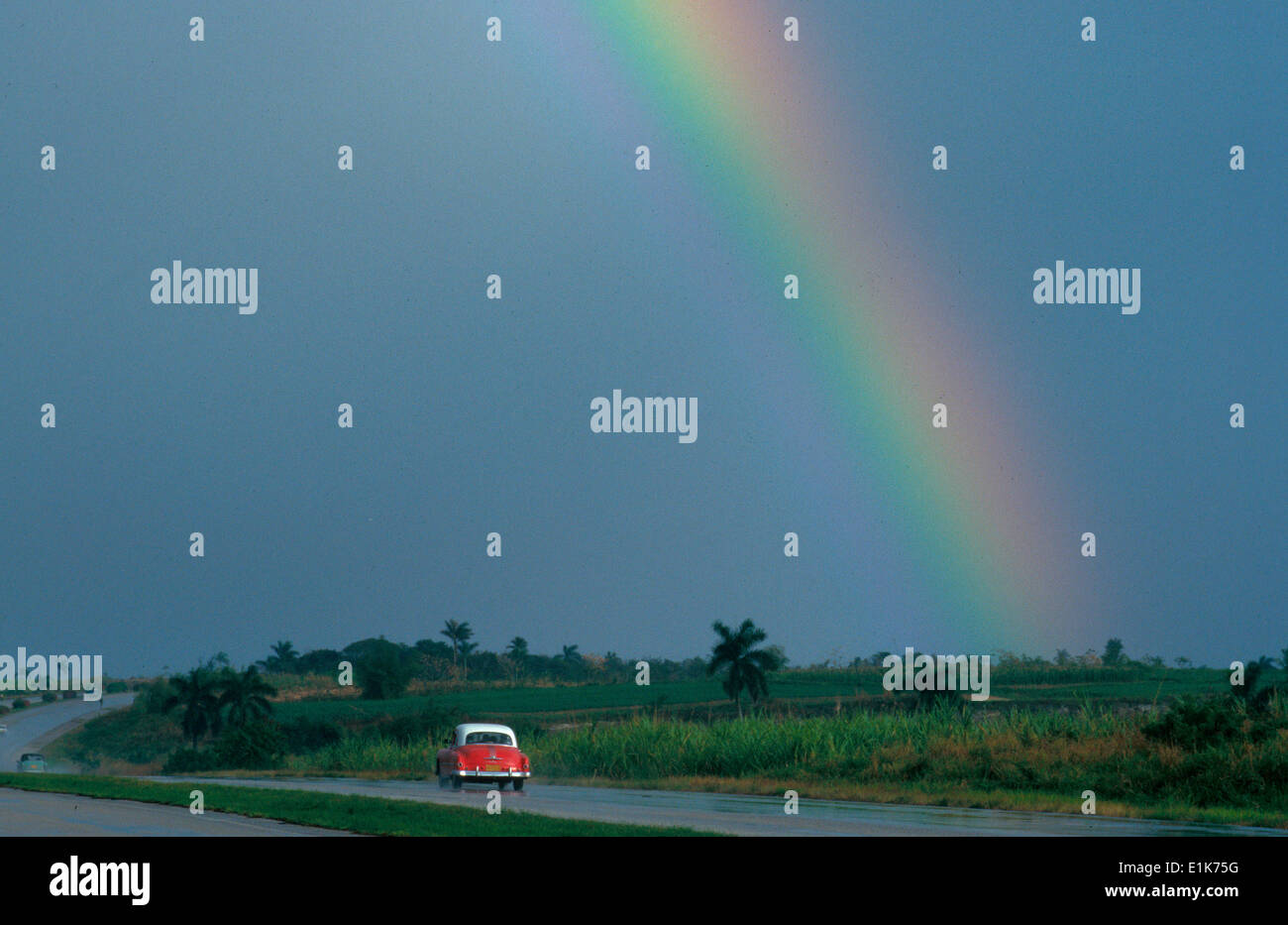 Rainbow over a road Stock Photo
