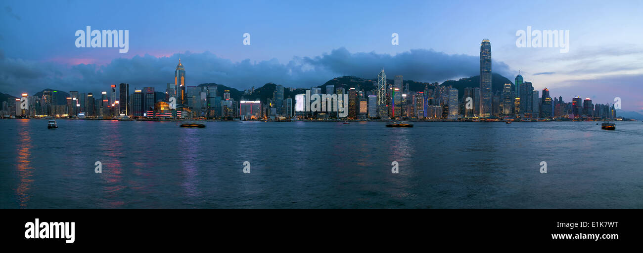 Hong Kong Island Central City Skyline Along Victoria Harbor Sunset Blue Hour Panorama Stock Photo