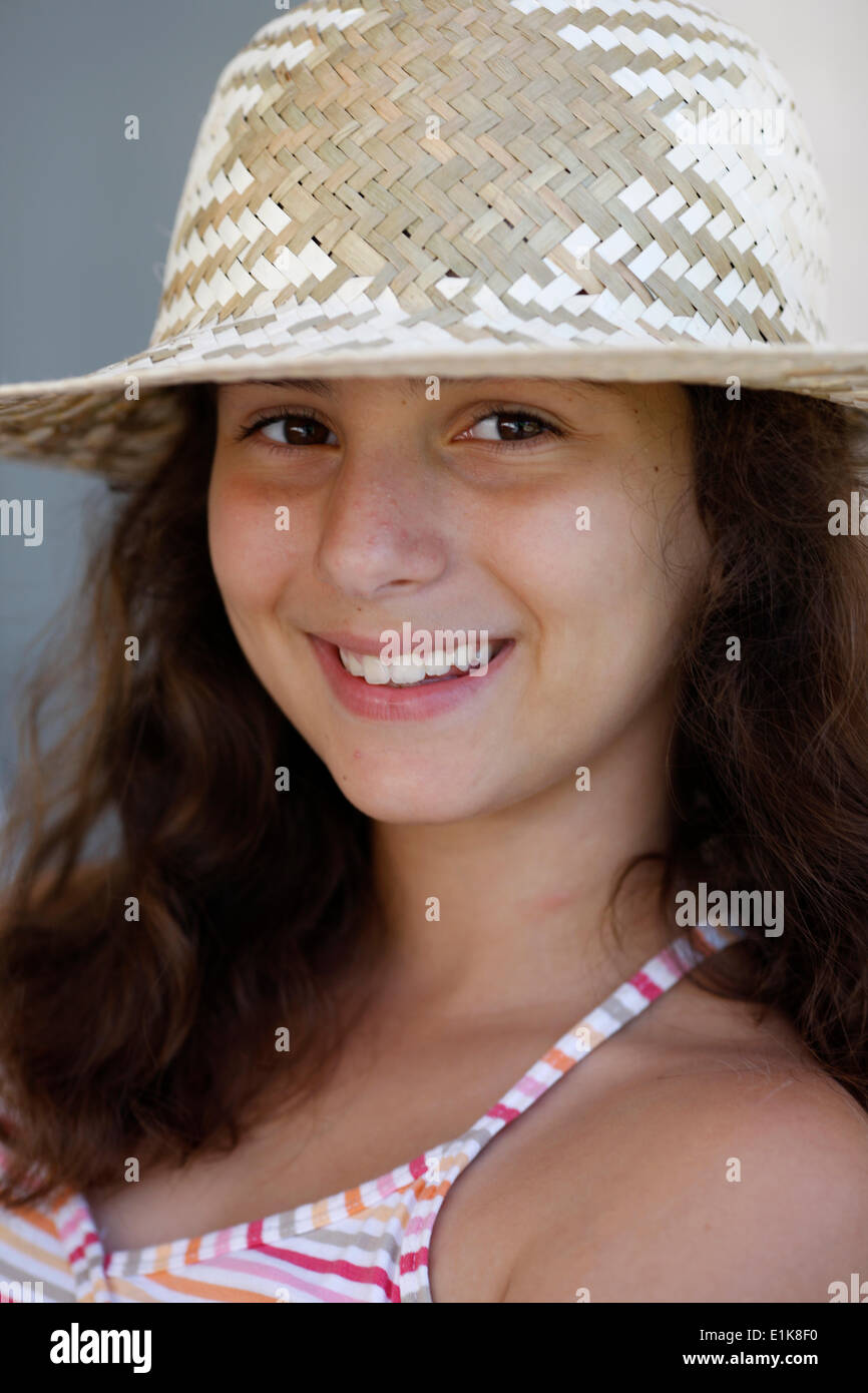 Smiling girl with straw hat Stock Photo - Alamy