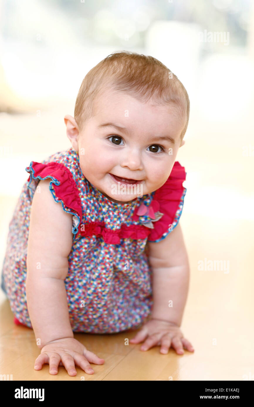 MODEL RELEASED Baby girl looking at camera portrait. Stock Photo