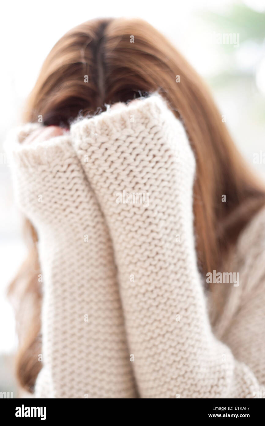MODEL RELEASED Woman covering her face with her hands Stock Photo - Alamy