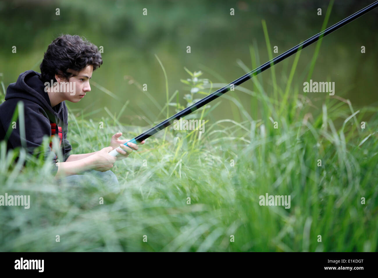 Teenager angling Stock Photo