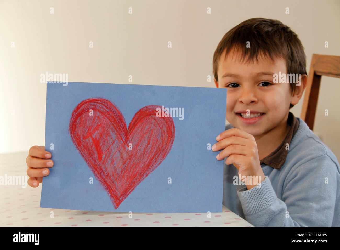 Boy showing a drawing Stock Photo