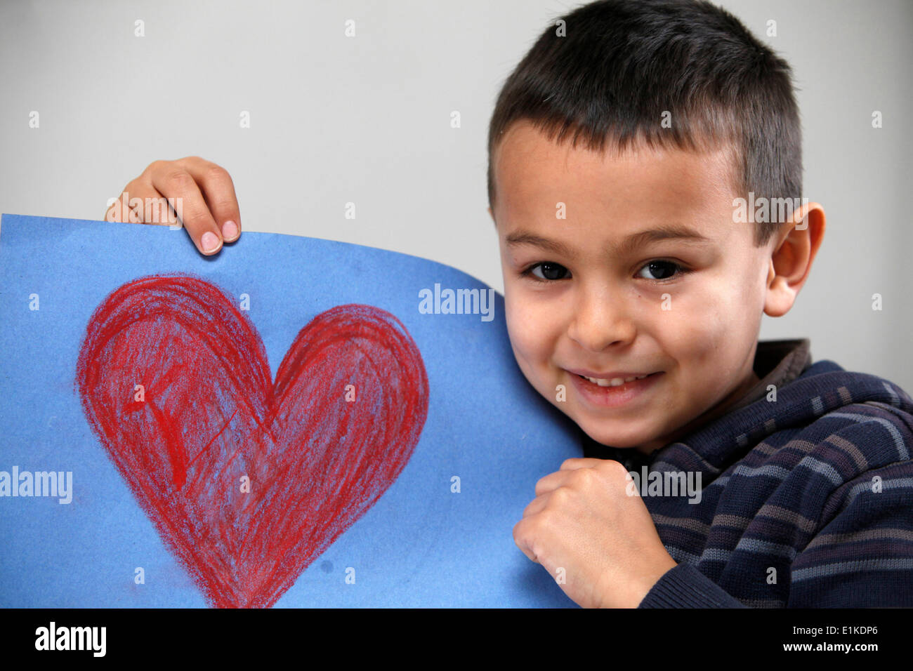 Boy showing a drawing Stock Photo