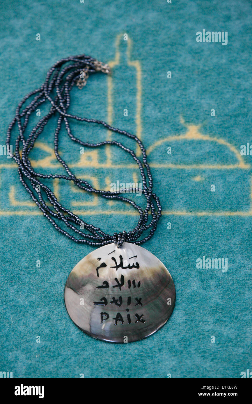 Jewel : peace in Arabic and French Stock Photo