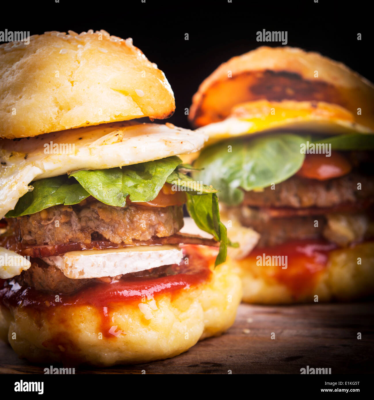 Home made gluten free mini burgers or sliders with beef, egg, lettuce, cheese and sauce Stock Photo