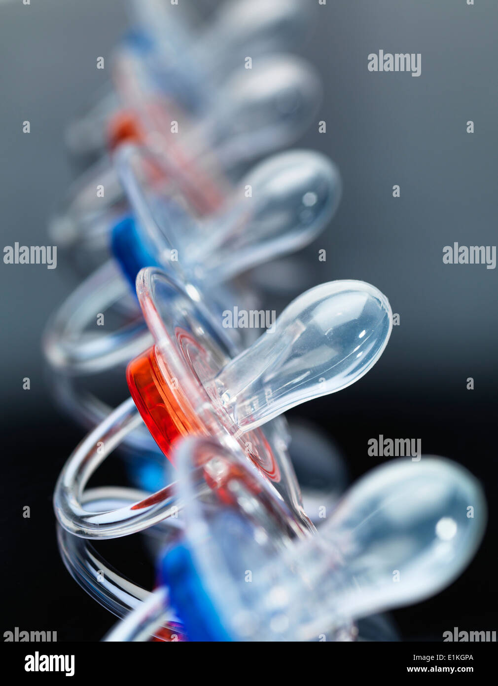 Babies' dummies in a row Stock Photo Alamy