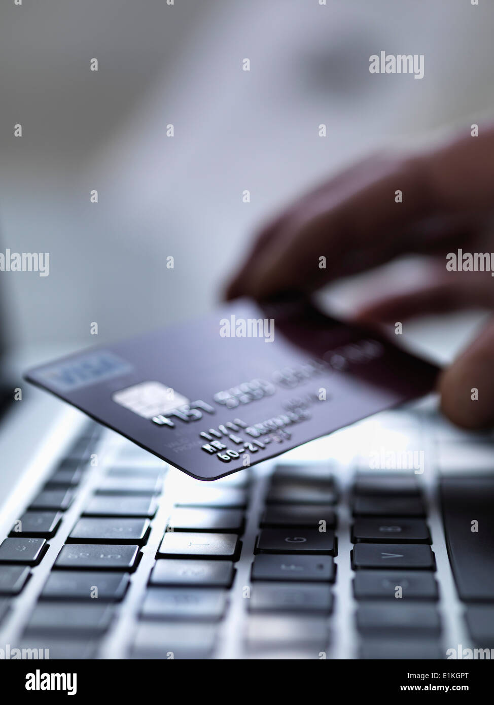 Person shopping on-line with credit card. Stock Photo
