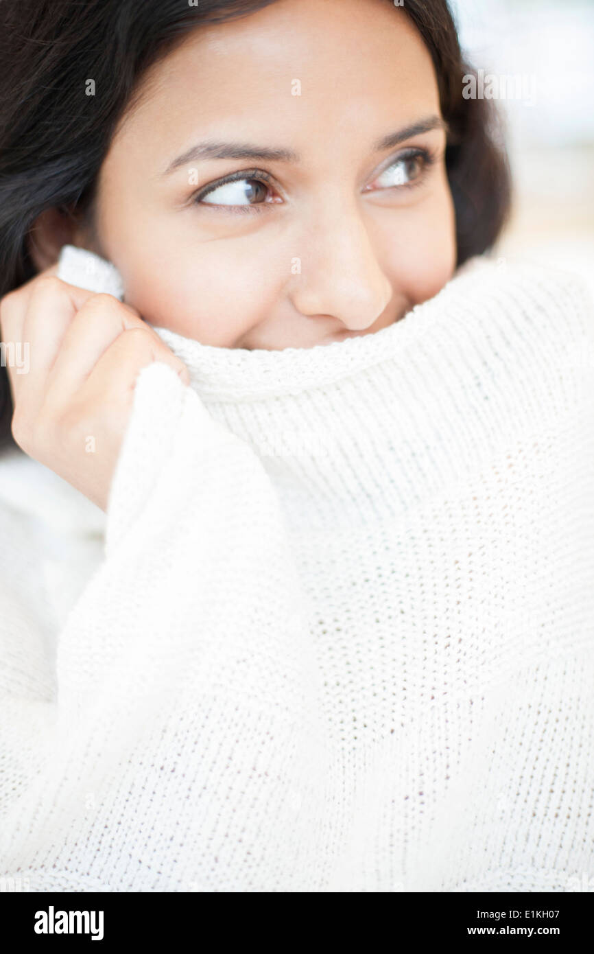 MODEL RELEASED Portrait of a woman wearing white jumper. Stock Photo