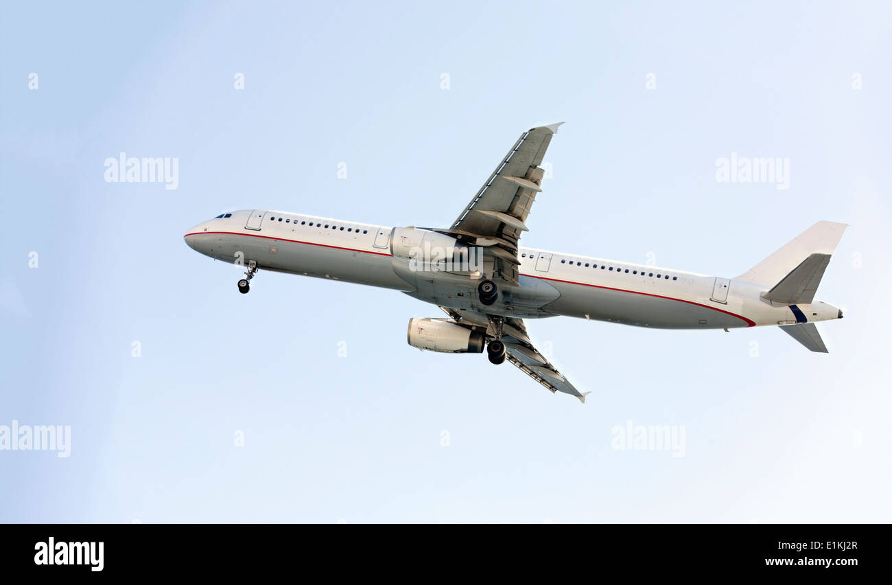 Passenger aeroplane in flight. Stock Photo