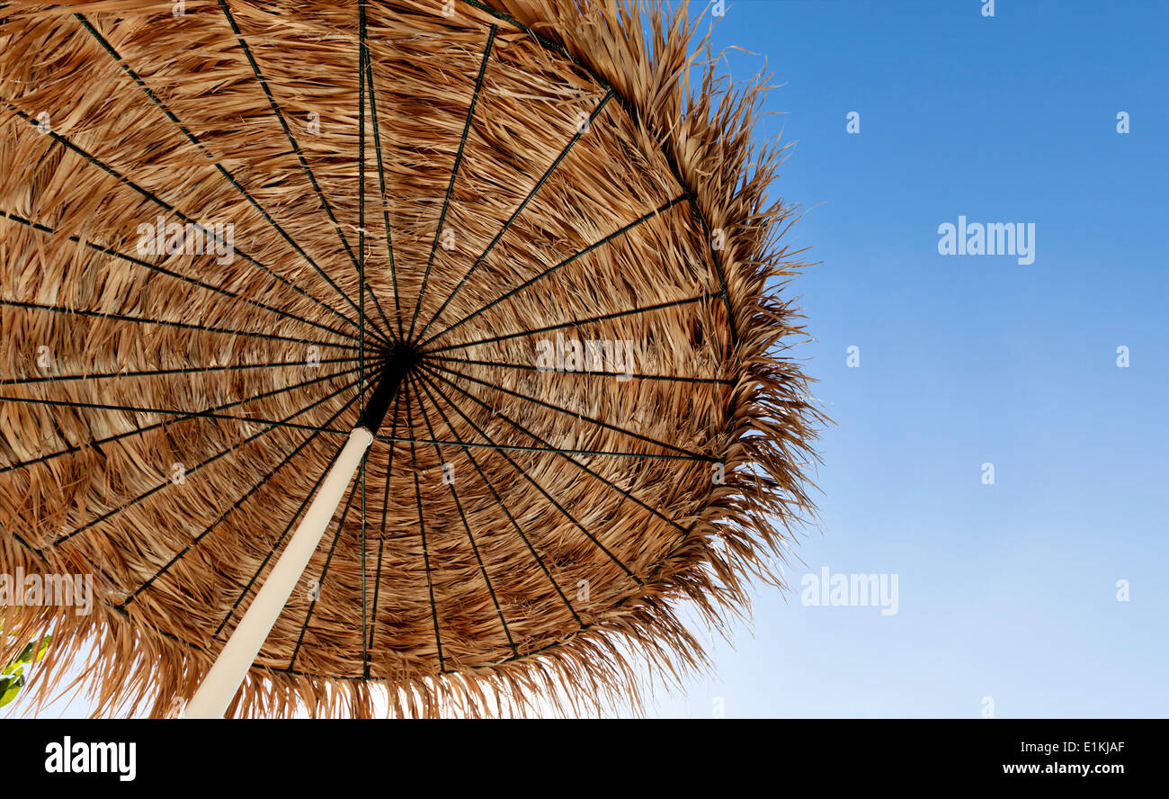 Beach umbrella against a clear sky low angle view. Stock Photo