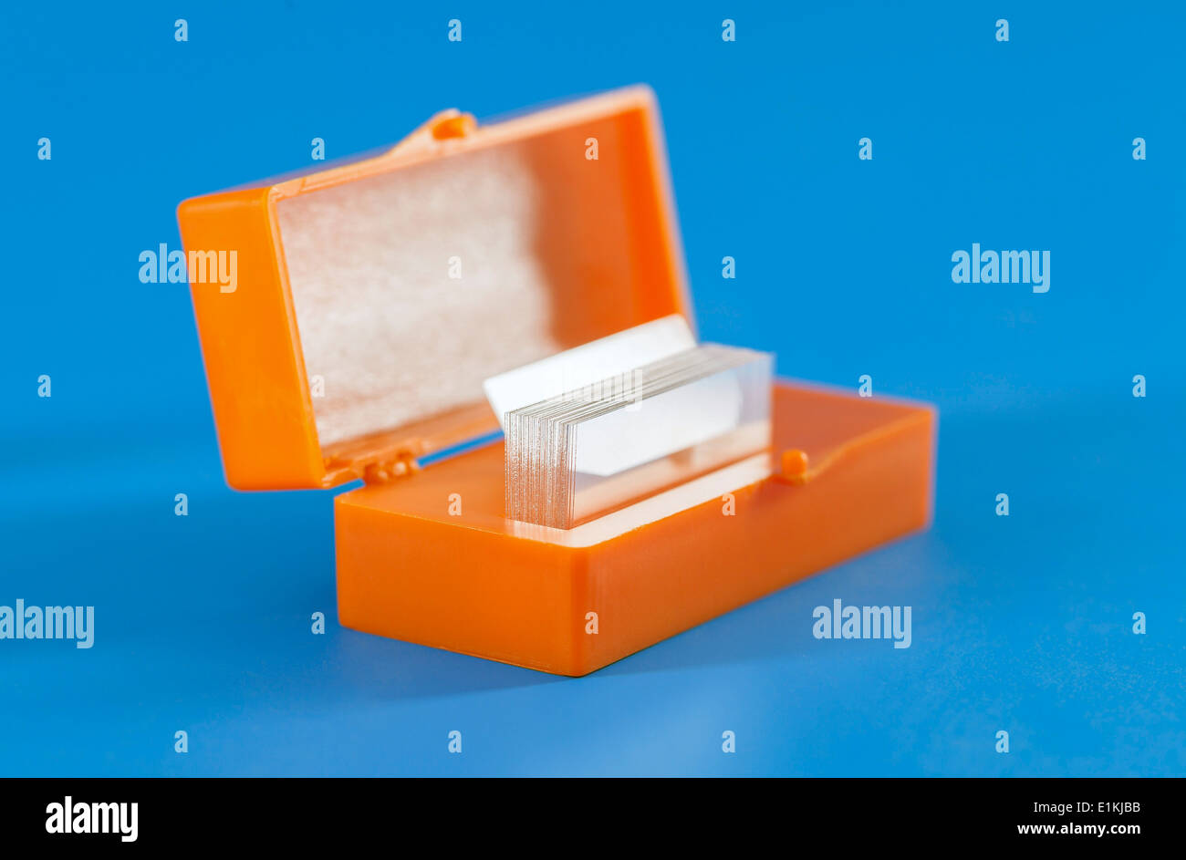 Microscope slides in an orange box. Stock Photo