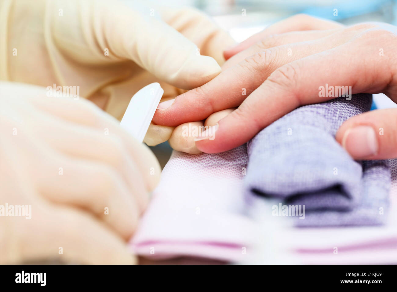 Person having a manicure close up. Stock Photo