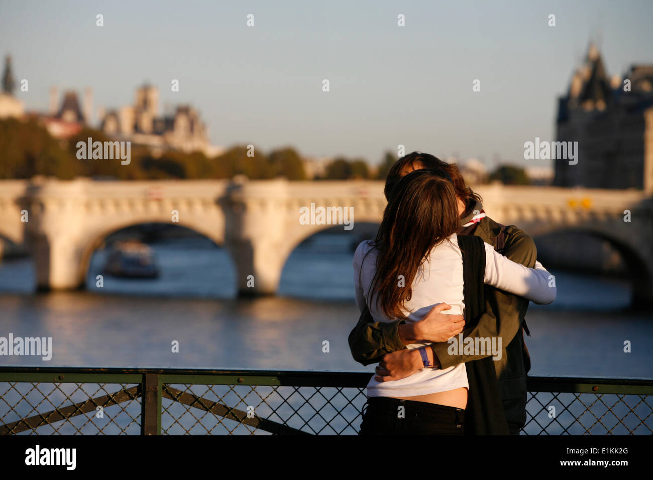 Couple hugging on bridge in hi-res stock photography and images - Alamy