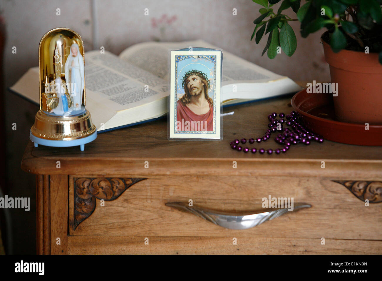 Religious paraphernaelia in a bedroom Stock Photo