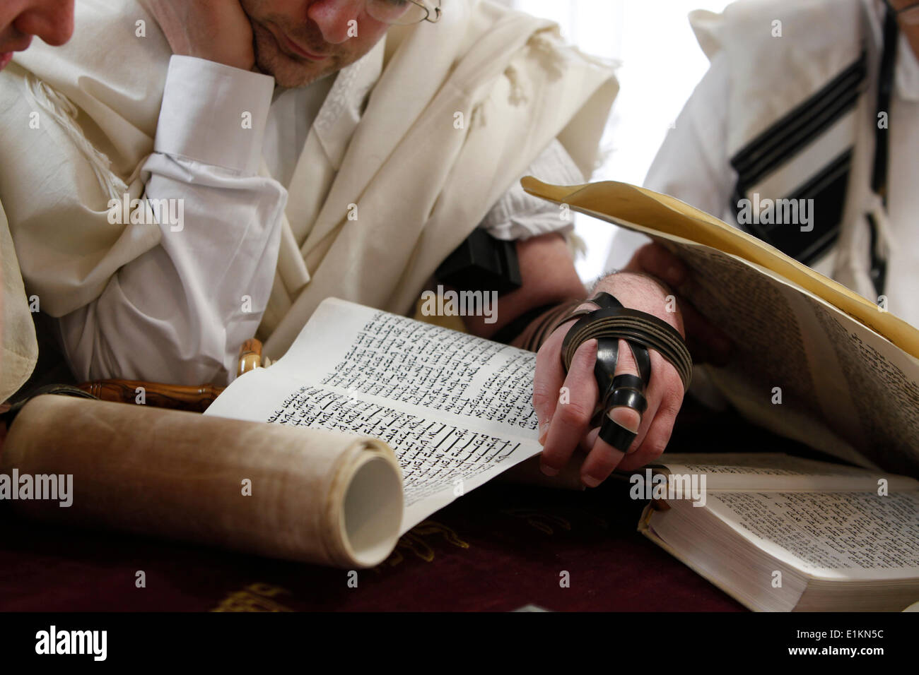 Purim celebration in a synagogue : reading the book of Esther Stock Photo
