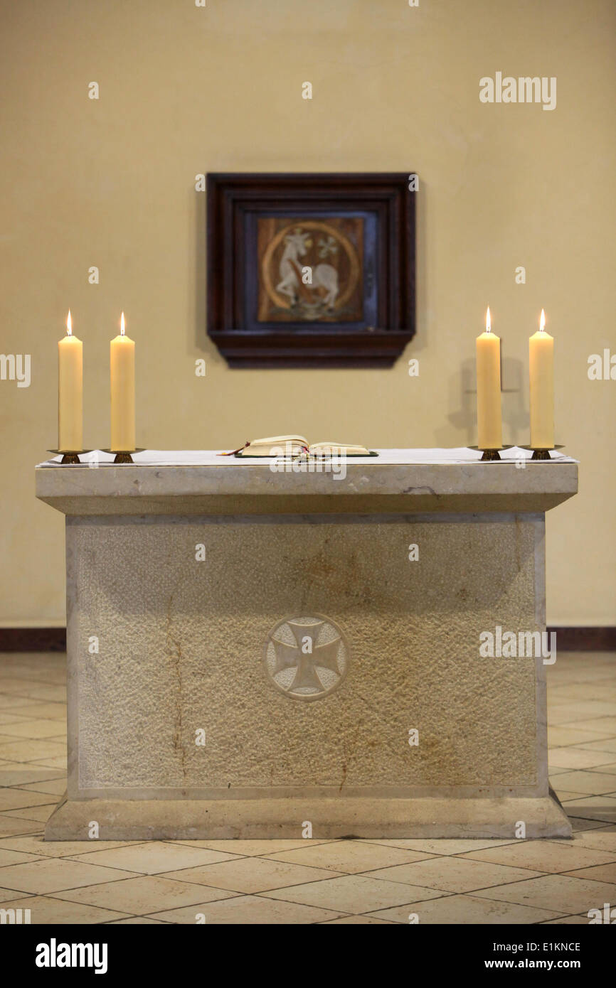 Bible and candles on altar Stock Photo Alamy