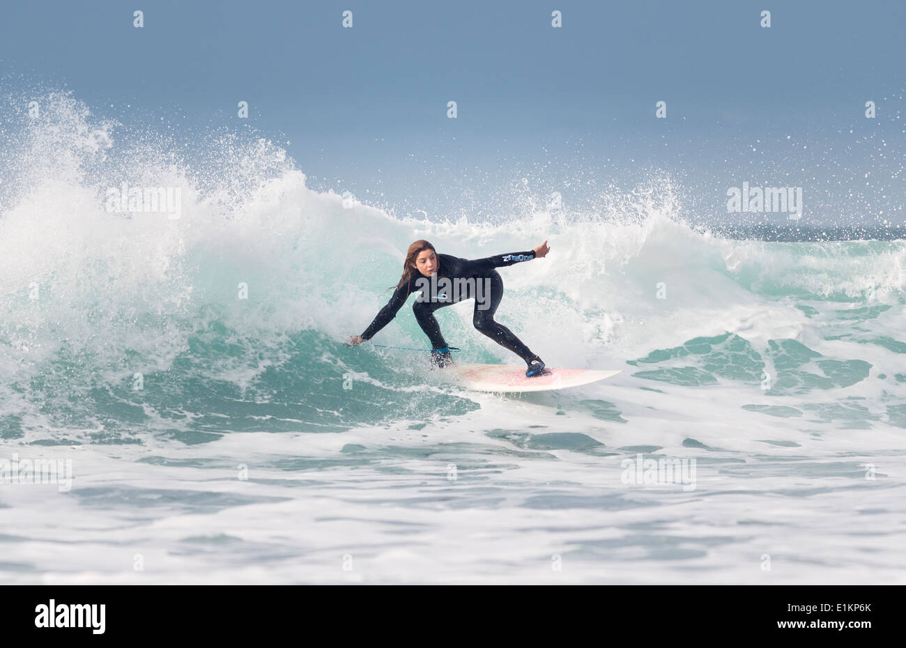Woman having fun surfing. Stock Photo