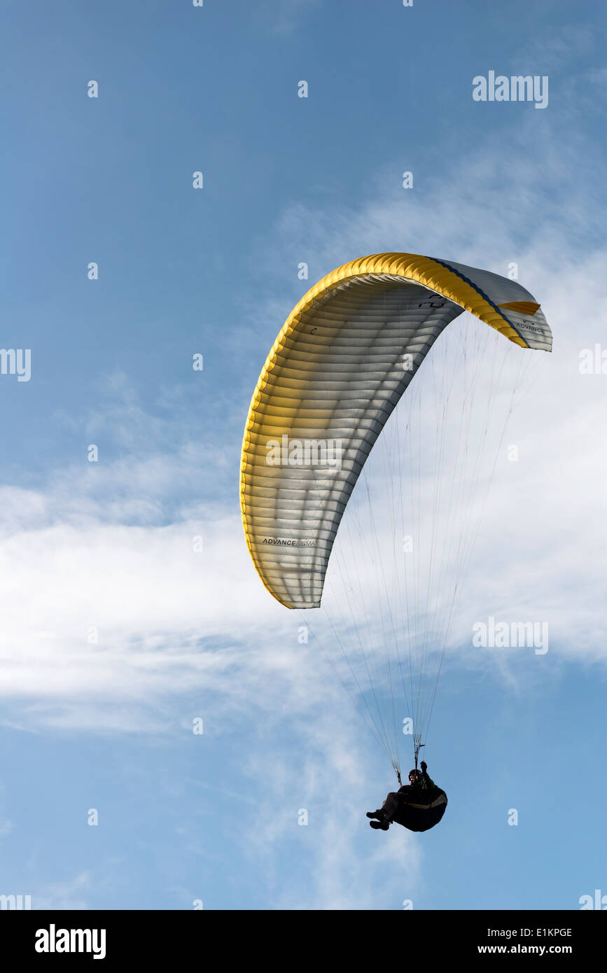 person airborne  on Paraglider in Derbyshire England Stock Photo