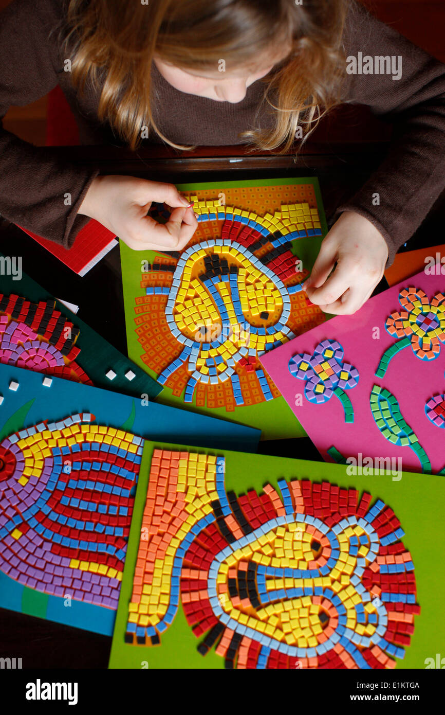 Child making mosaics Stock Photo Alamy