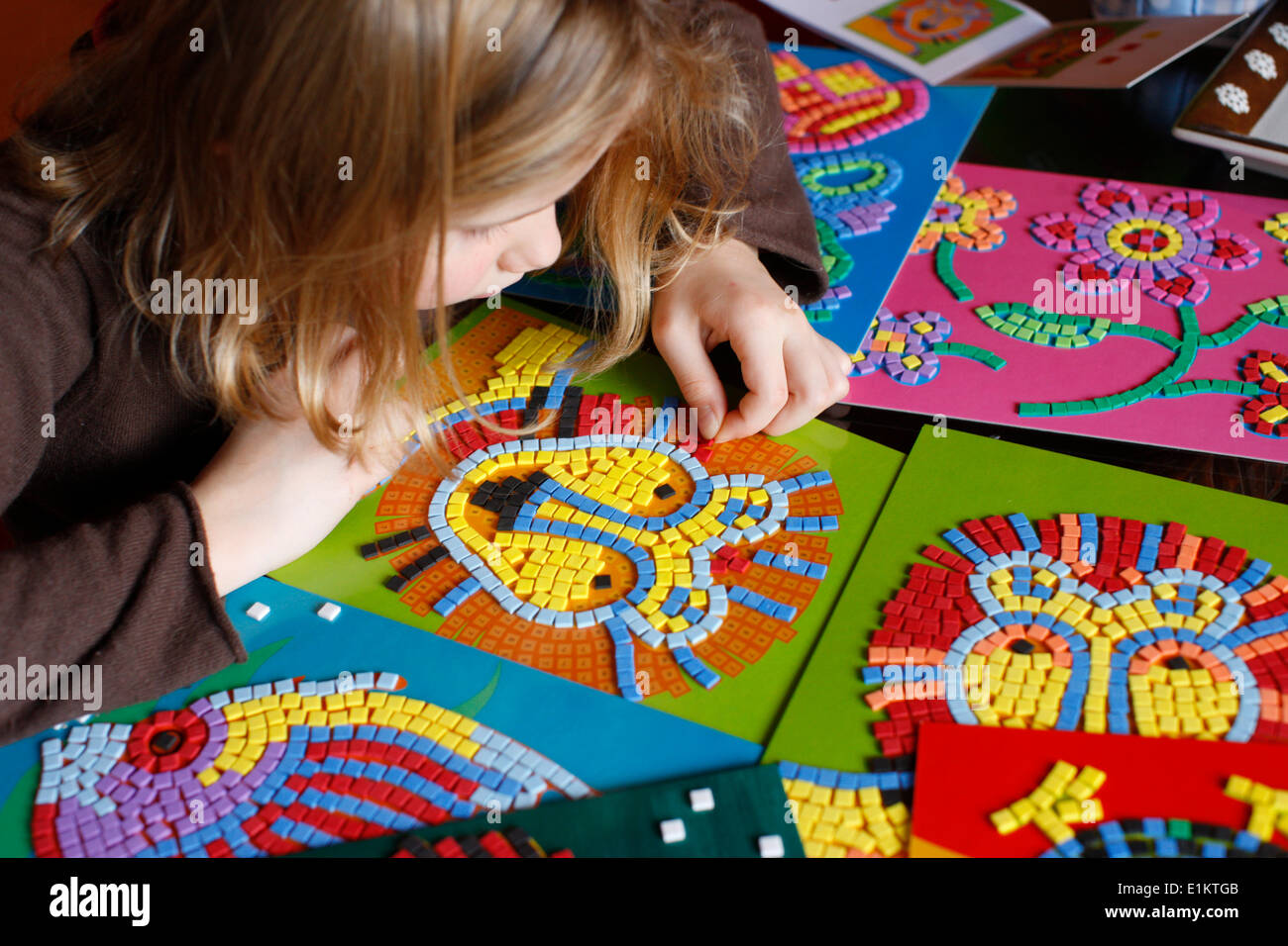 Child making mosaics Stock Photo Alamy