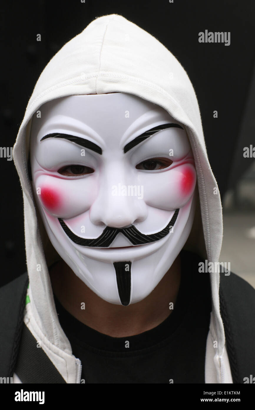 Protester wearing a Guy Fawkes mask , trademark of the Anonymous movement  and based on a character in the film V for Vendetta Stock Photo - Alamy