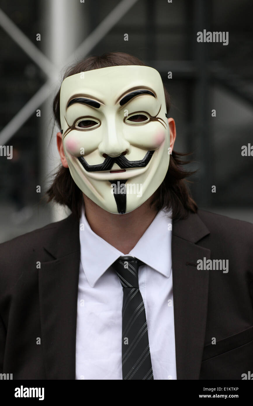 Protester wearing a Guy Fawkes mask , trademark of the Anonymous movement  and based on a character in the film V for Vendetta Stock Photo - Alamy