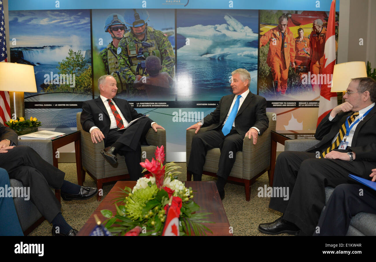 U.S. Secretary of Defense Chuck Hagel, center right, meets with Canadian Minister of National Defense Robert Nicholson, center Stock Photo