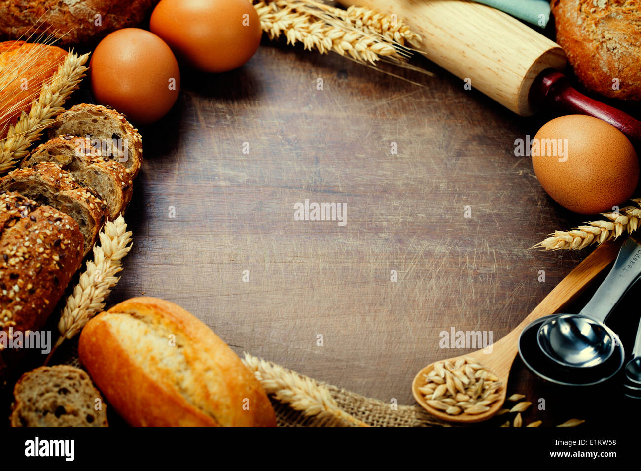 Bread and ingredients frame on wooden table Stock Photo
