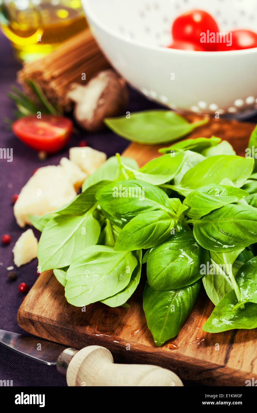 Basil and ingredients for making italian pasta Stock Photo